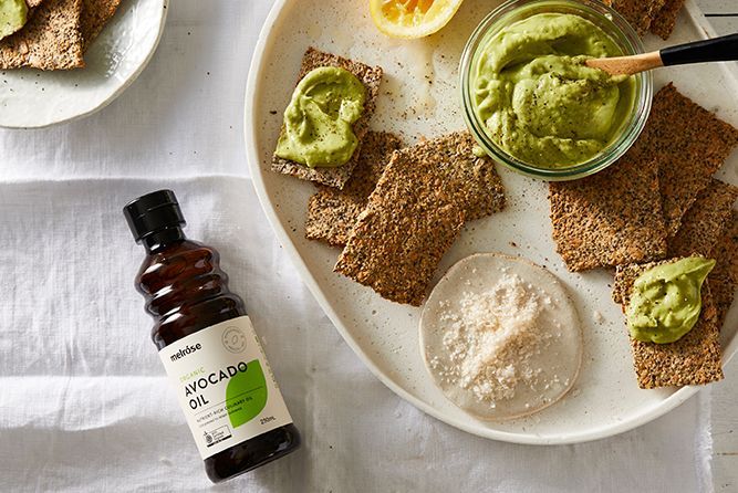 AVOCADO, LIME AND TAHINI DIP WITH FLAX CRACKERS
